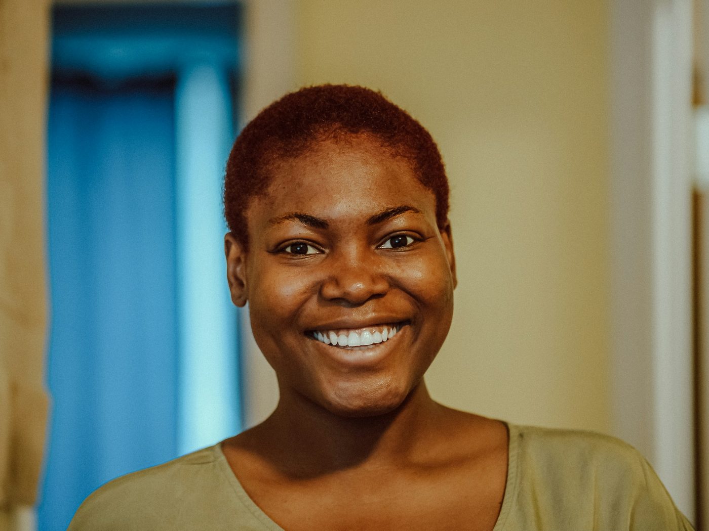 A patient smiling confidently after cosmetic dental treatment